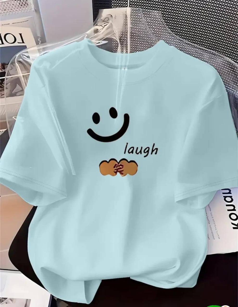 LIGHT BLUE T-SHIRT WITH 'LAUGH' PRINT