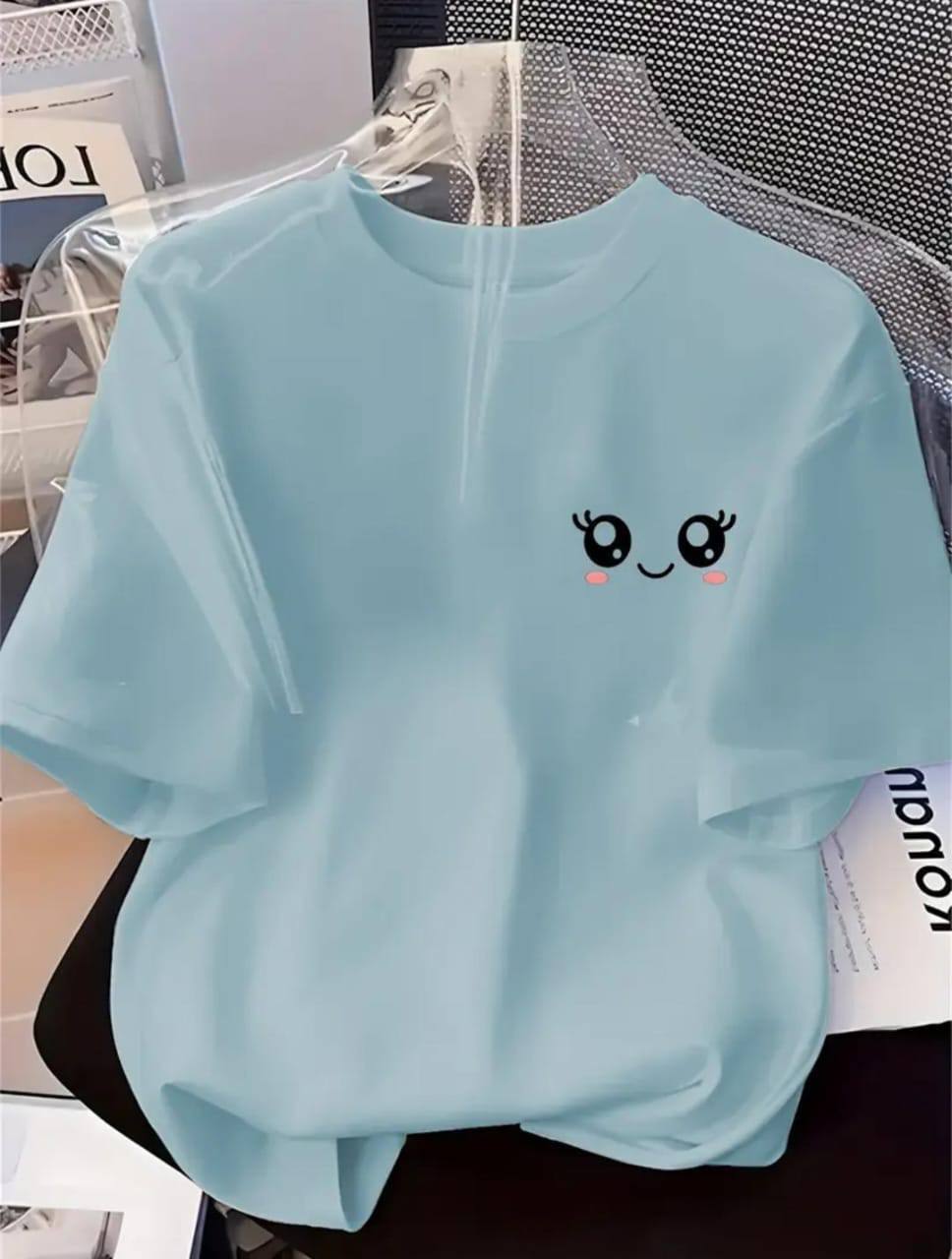 LIGHT BLUE TEE WITH A SMILEY FACE PRINT