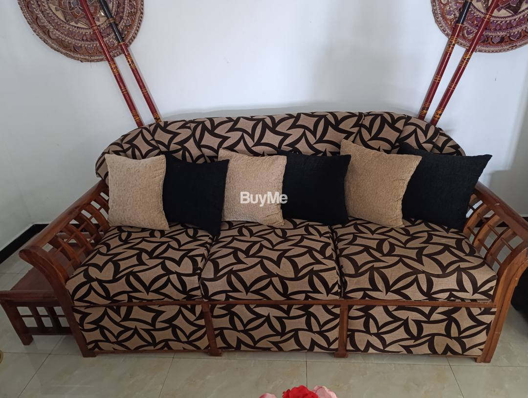 A TEAK WOOD SOFA